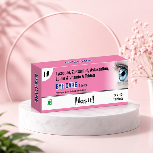 A pink and white box of Hasit! Eye Care Tablets displayed on a round white marble pedestal against a soft pink background with decorative arches and flowers.